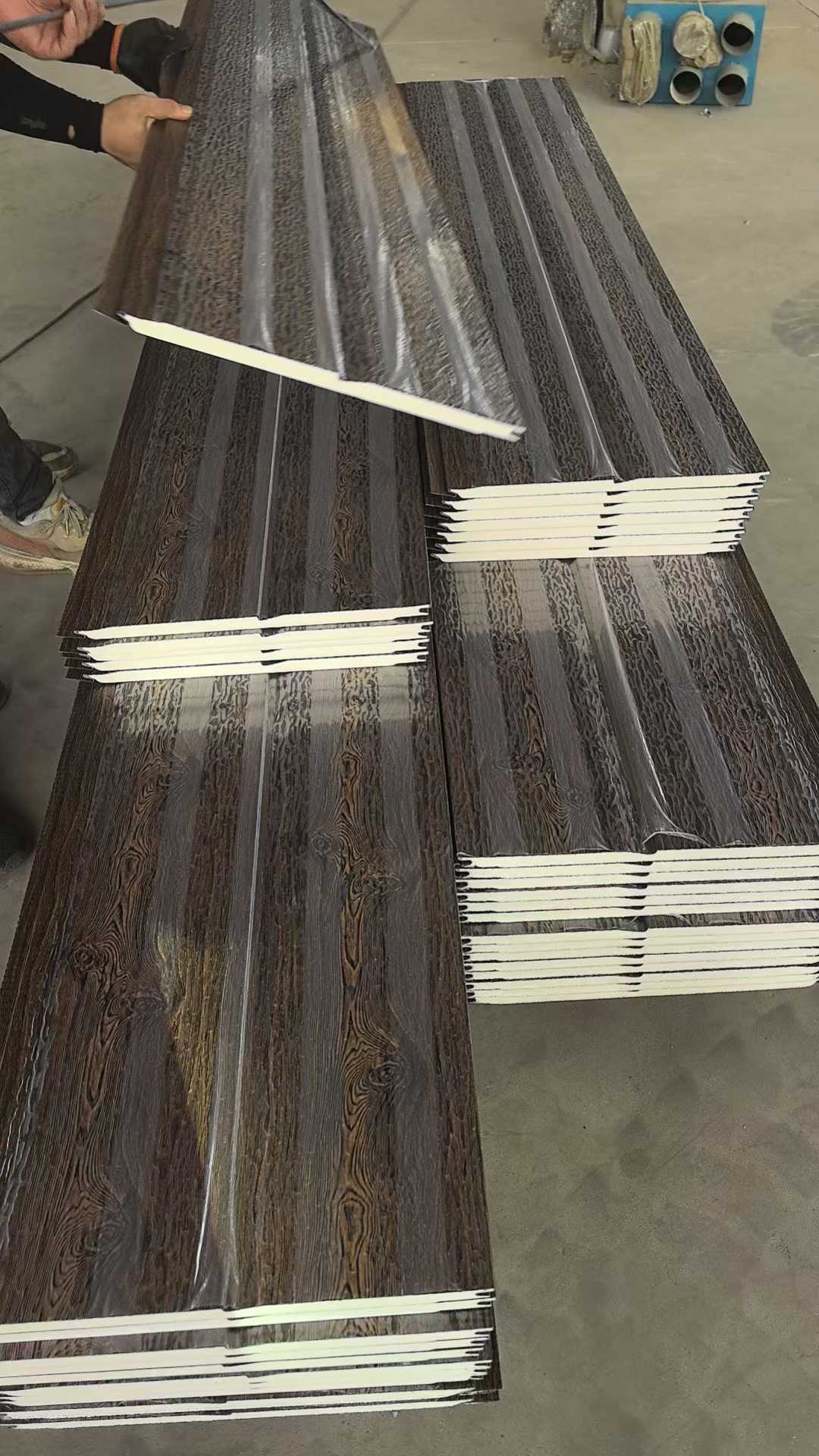 Stack of wooden panels on a concrete floor