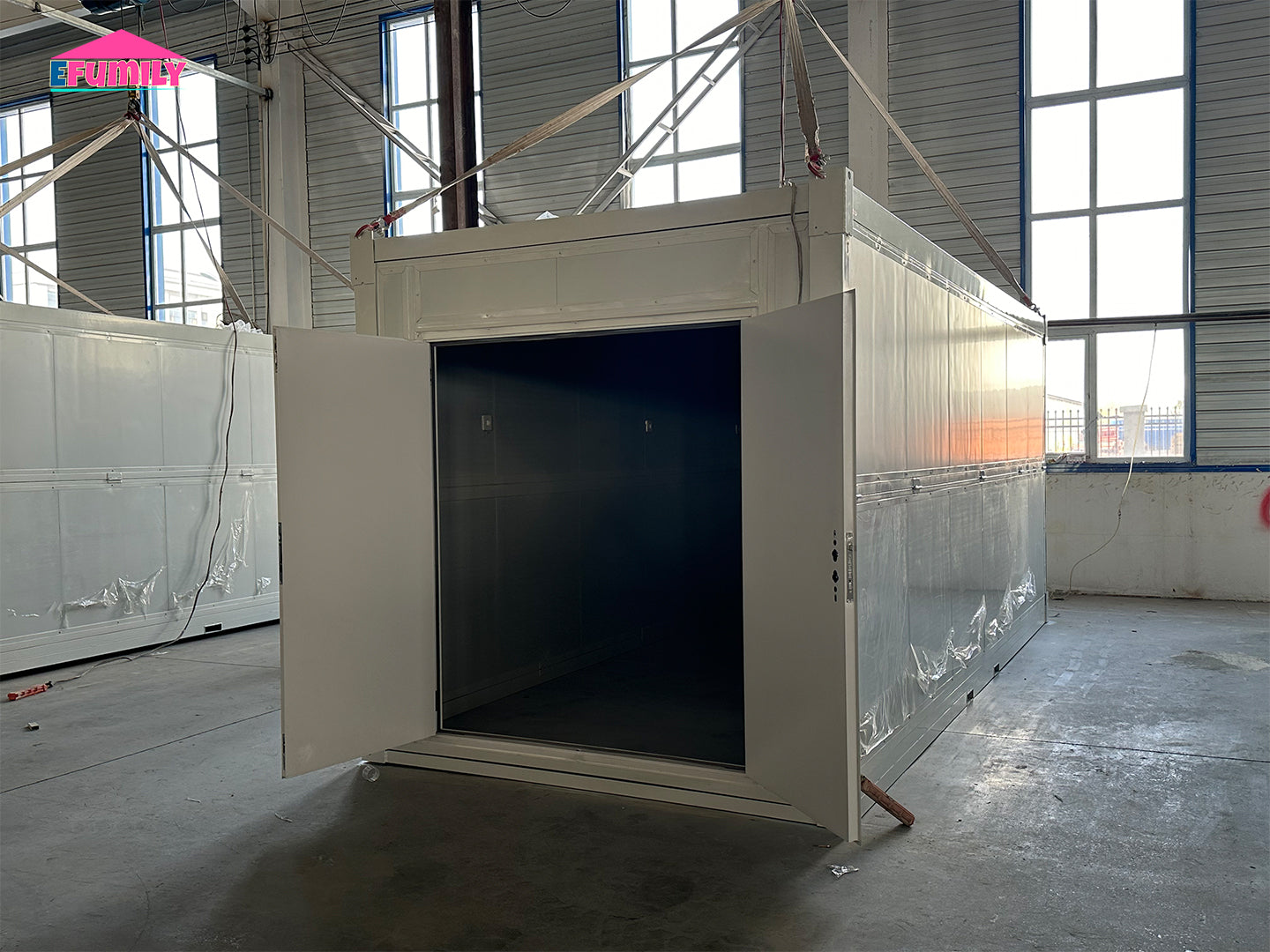 Modular building or container in a large industrial or warehouse setting