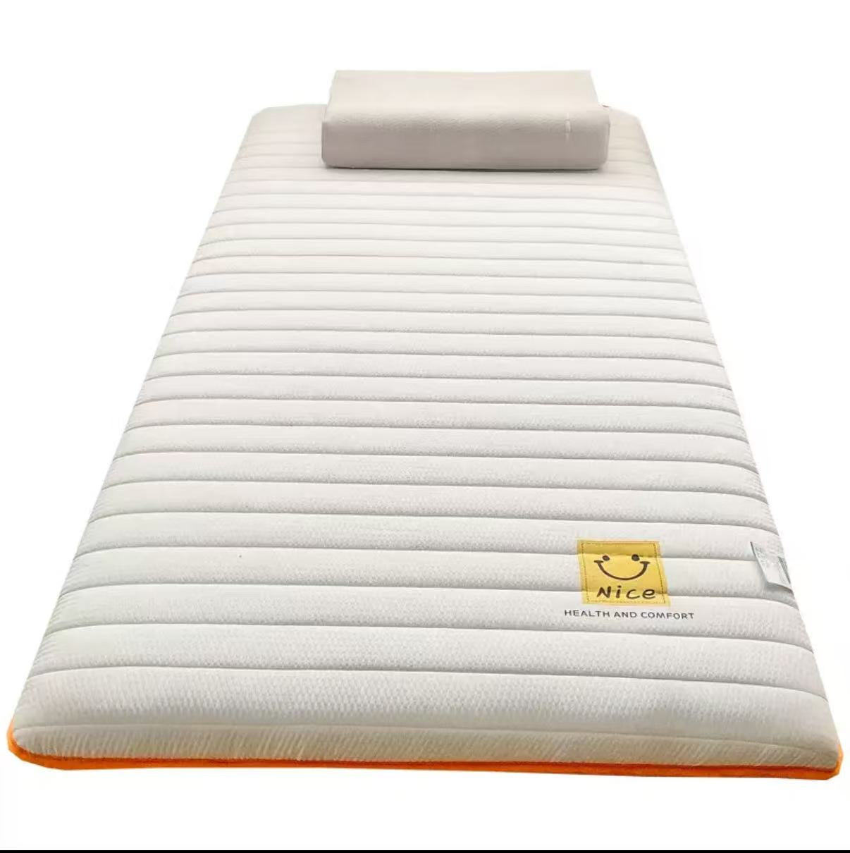 White mattress with a rolled-up pillow on a white background