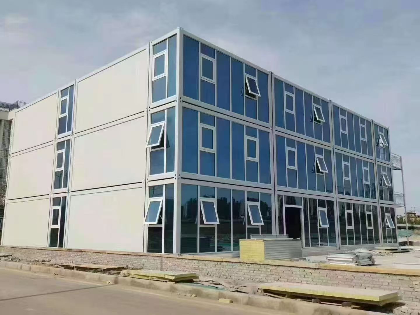 Modular building with blue and white exterior on a clear day