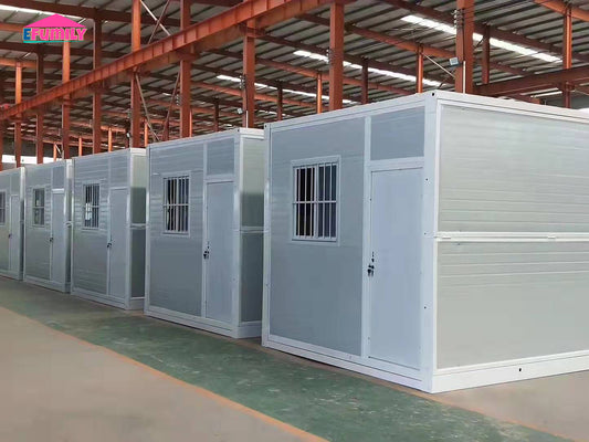 Row of prefabricated modular buildings in a warehouse setting